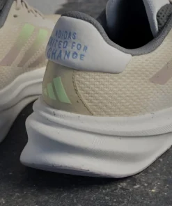 Adidas Women's Supernova Stride Move for the Planet Shoes Crystal Sand/Green Spark/Preloved Fig
