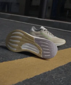 Adidas Women's Supernova Stride Move for the Planet Shoes Crystal Sand/Green Spark/Preloved Fig