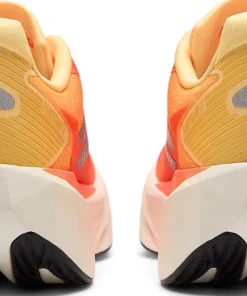 New Balance Women's Fuelcell Rebel V5 Tangerine Heat